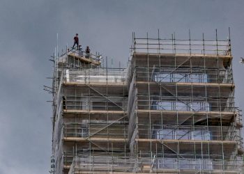 One of the astonishing pictures of youths who had scaled one of the tallest buildings in the south west and were seen posing pricariously at the top. See SWNS story SWSTUNT; A group of young people have scaled one of the tallest buildings in the South West, which is currently under construction. The 22-storey, 78m-high (256ft), Beckley Point building in Plymouth, is due to be occupied by university students from September. It is unclear whether the group was "rooftopping" - climbing to the top of structures to take photographs. Devon and Cornwall Police said it was aware of the incident.