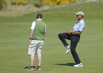 Former US President Barack Obama celebrates after a succesful put as he plays the Old Course at St Andrews, Fife, Scotland, on his visit to Scotland. May 26, 2017.