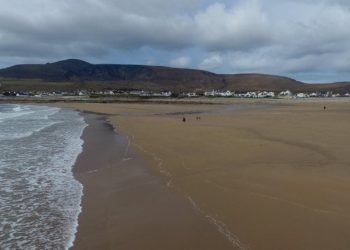 Villagers are delighted after this entire beach that was washed away 33 years ago has re-appeared - virtually overnight thanks to a freak tide. See SWNS story SWBEACH; The stunning beach near the Irish village of Dooagh on Achill Island vanished in Spring storms of 1984 after waves washed away all the sand. With nothing more than rock pools left behind, almost all the villages' hotels, guesthouses and cafes shut down. But miraculously thanks to a freak tide, hundreds of thousands of tons of sand were dumped on the beach over ten days in April, re-creating a stunning 300m long beach.