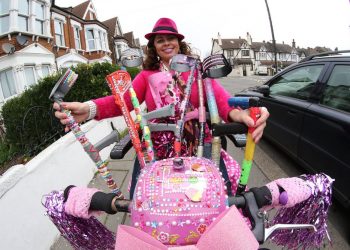 Sarah Chelsom who is famous in South Norwood for her pink and highly decorated scooter. See National News story NNSCOOTER: A disabled woman says she was punched in the head for cruising around town on her bright pink mobility scooter - that is decorated with gemstones. Sarah Chelsom, who glammed-up her scooter with diamantes and rhinestones simply to make her neighbours' smile, says she was punched in back of the head as she rode around her home estate. Flamboyant Sarah, 51, from South Northwood, south London, is calling for more bobbies on the beat after she was left frightened after the unprovoked attack by an unknown female assailant. Sarah, said: "Since then I felt so frightened and shaken up that I couldn't sleep and that's when I knew I needed to do something, South Norwood has gone downhill and even more so since the police station closed.