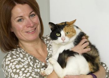 Elaine Harman with her cat Ginny who had gone missing from the family home in Dunbar, West Lothian only to turn up 30 miles awayy at Portobello Beach in Edinburgh. See Centre Press CPCAT; A family have been reunited with their beloved cat which went AWOL one year ago and decided to live on a BEACH. Adventurous Ginny disappeared last summer, leaving her owners distraught and worried. But the Harmans were left stunned when they received a call out of the blue informing them that Ginny had been discovered living by the sea. The three-year-old feline had embarked upon a 30-mile journey, from Dunbar, East Lothian, to Portobello, a coastal suburb of Edinburgh. There, she was spotted numerous times by passers-by over the last year.