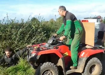 This is the shocking moment a farmer was caught on camera driving a quad bike at a group of fox hunt demonstrators.  See NTI story NTIHUNT.  Footage released by West Midlands Hunt Saboteurs shows an altercation between a member of Atherstone Hunt and a group of protestors filming the hunt on their mobile phones.  The farmer, dressed in John Deere overalls, drives a quad bike up to three men and shouts at them to get off his land.  He then pushes one into a ditch and begins attacking whoever he can reach in the three-and-a-half minute video.  He confronts the demonstrators and tries to prevent them filming him before knocking another to the ground.  He continues to drive at the protestors with his quad bike, telling them, You are on private property, I can do what I want.  The dramatic footage filmed on Saturday (14/10) in Ratcliffe Culey, Leics., captures the moment the farmer drives another person into a ditch and can be heard saying, Thats one more, does anybody else want some?