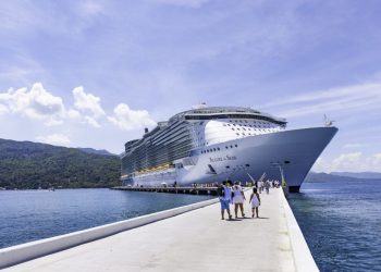 Labadee, Haiti - October 9, 2012: Passengers disembark the Royal Caribbean Cruise ship the Allure of the Seas for a day of beach activities. With a passenger capacity of over 8 thousand, the Allure of the Seas is the largest cruise ship in the world to date.