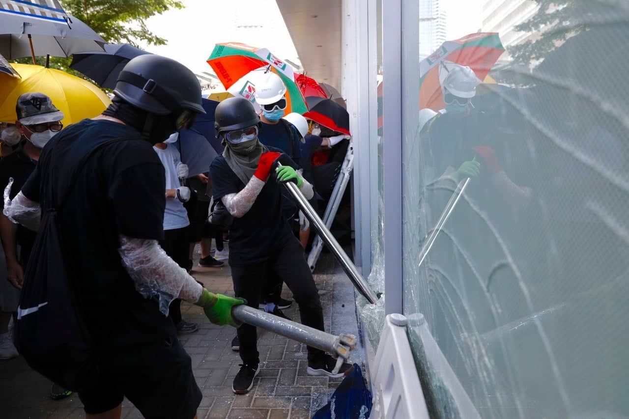 Protests escalate as Hong Kong marks handover to China