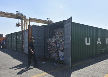 Indonesian custom officers open containers full of waste at the Tanjung Perak port in Surabaya, East Java, Indonesia, Tuesday, July 9, 2019. Indonesia is sending dozens of containers of imported waste back to Western nations after finding it was contaminated with used diapers, plastic and other materials, adding to a growing backlash in Southeast Asia against being a dumping ground for the developed world's rubbish.(AP Photo)