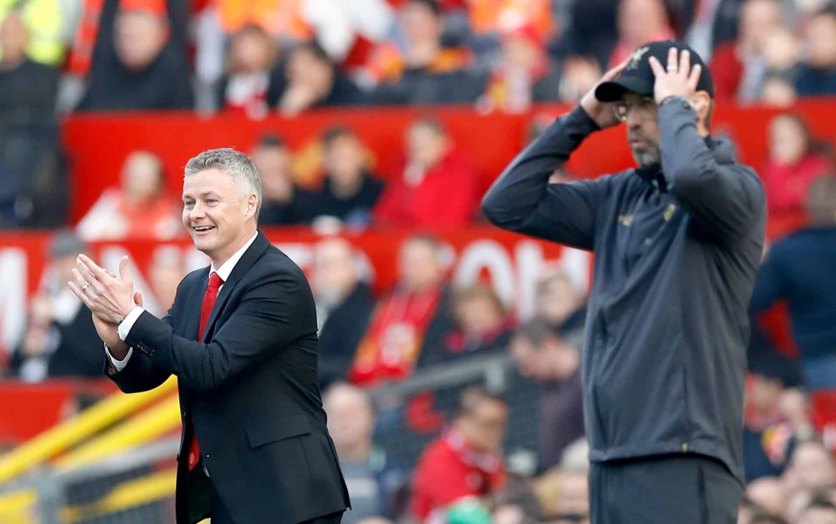 Manchester United caretaker manager Ole Gunnar Solskjaer (left) and Liverpool manager Jurgen Klopp react from the touchline during the Premier League match at Old Trafford, Manchester. Credit;PA