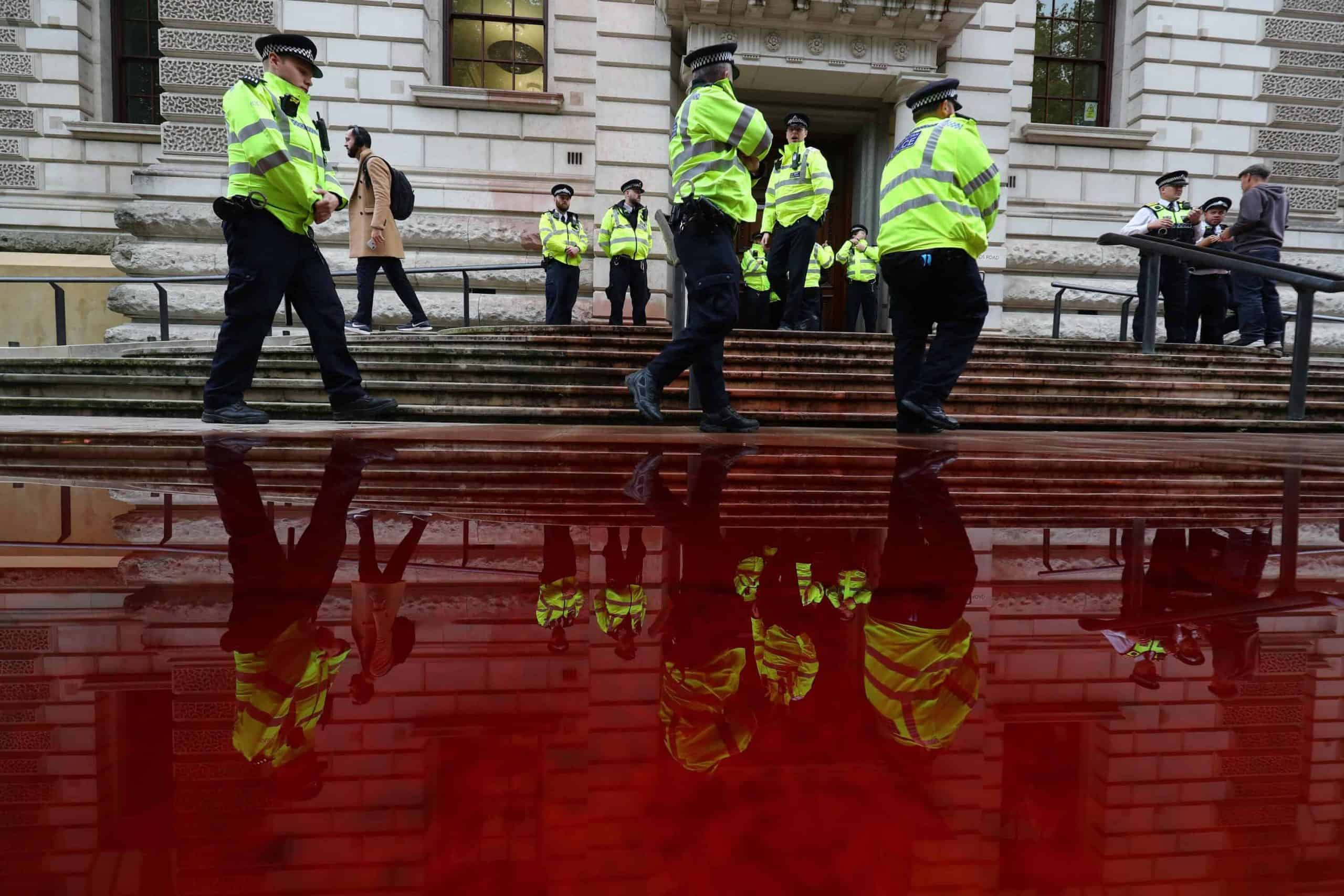 Arrests after climate protesters spray almost 400 gallons of fake blood across Treasury steps