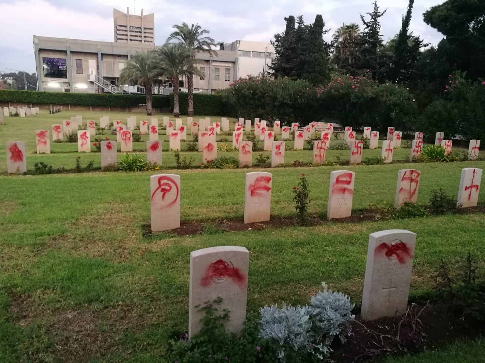 Commonwealth war graves knocked over and daubed with swastikas