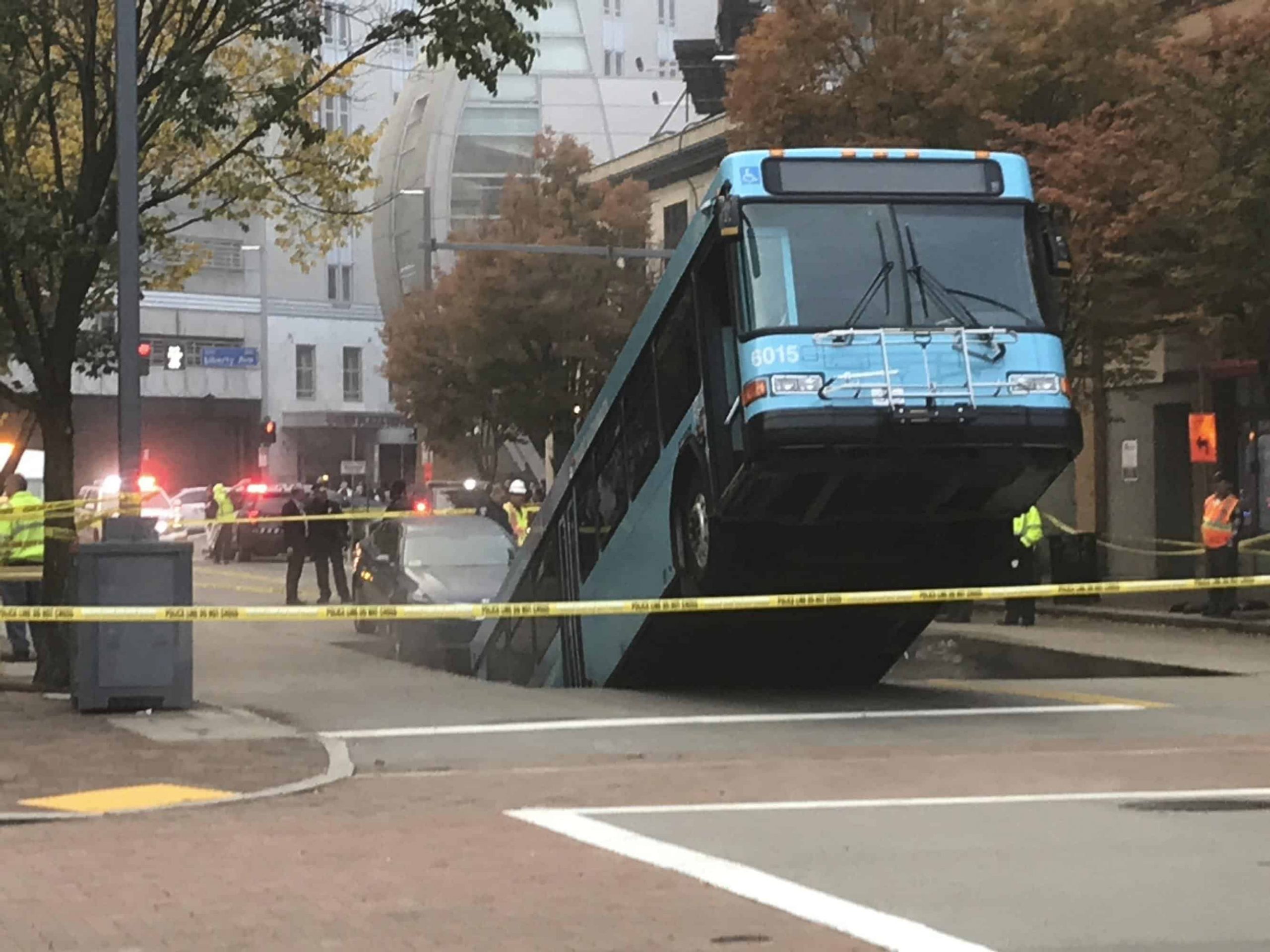 Sinkhole swallows part of city bus during rush hour