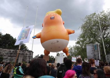 The Trump baby blimp is flown at the Garden of Remembrance in Dublin (Liam McBurney/PA)