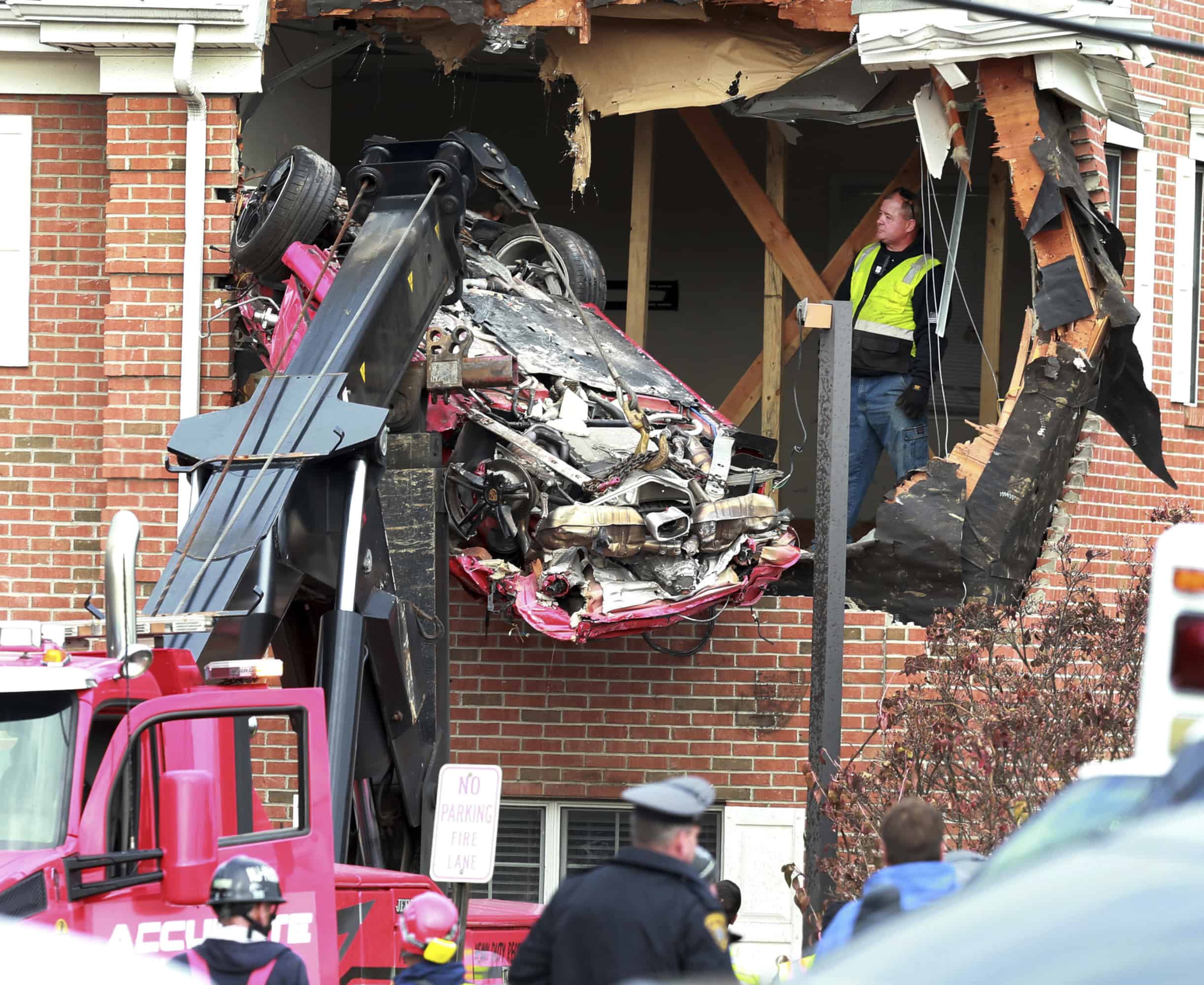 Two killed after Porsche becomes airborne and crashes into building