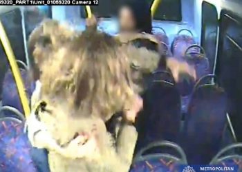 Handout CCTV grab issued by the Metropolitan Police of Melania Geymonat and her girlfriend Christine Hannigan being surrounded by a group on teenagers during an incident on a London bus in the early hours of May 30. A teenager who admitted targeting a same-sex couple on a night bus after they refused to kiss will be sentenced later on Thursday.