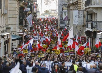 People stage a protest in La Valletta, Malta, Sunday, Dec. 1, 2019. Malta's embattled prime minister has received a pledge of confidence from Labor Party lawmakers amid demands for his resignation by citizens angry over alleged links of his former top aide to the car bomb killing of a Maltese anti-corruption journalist. Hours later, thousands of Maltese protested outside a courthouse demanding that Joseph Muscat step down. (AP Photo)