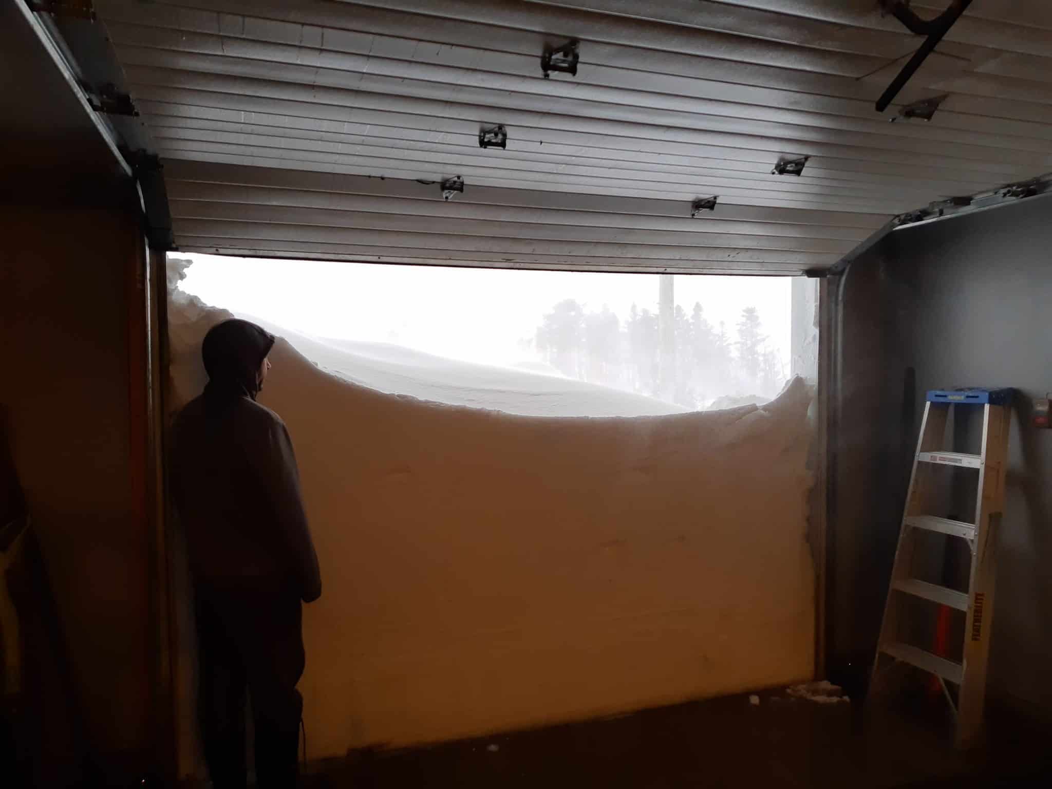 Canadians open garage door on record-breaking snowfall as emergency called