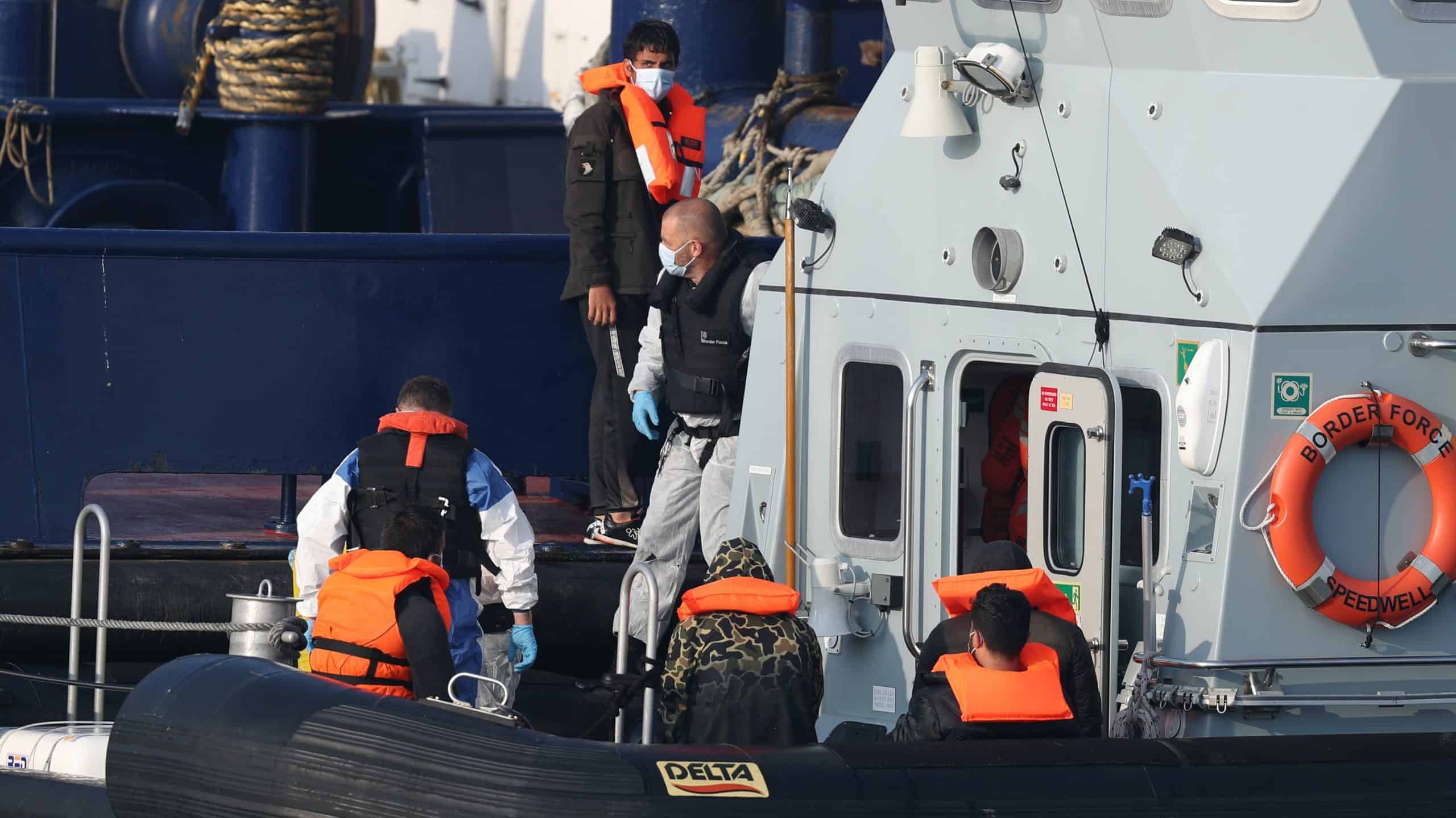 Migrant who crossed Channel in a rubber dinghy attacked after landing at coast