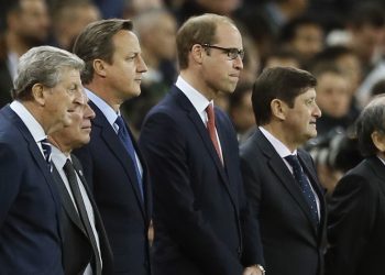 England coach Roy Hodgson, left, British Prime Minister David Cameron, second left, Britain's Prince William the Duke of Cambridge and France head coach Didier Deschamps, right, stand before the international friendly soccer match between England and France at Wembley Stadium in London, Tuesday, Nov. 17, 2015. France is playing England at Wembley on Tuesday after the countries decided the match should go ahead despite the deadly attacks in Paris last Friday night which killed scores of people. (AP Photo/Kirsty Wigglesworth)