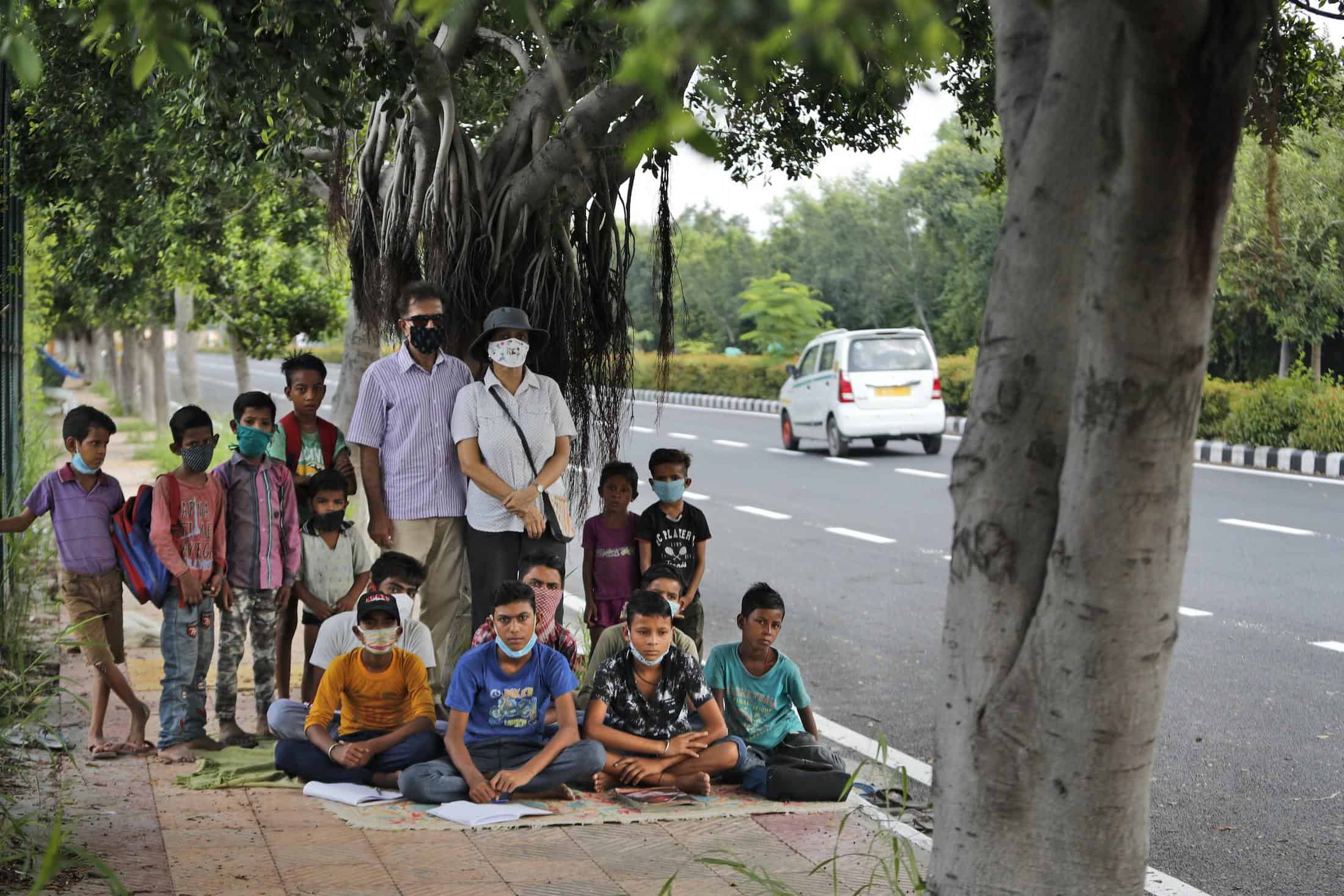 ‘Come & help these children’ as Couple run street-side classes for poor students as Covid shut schools