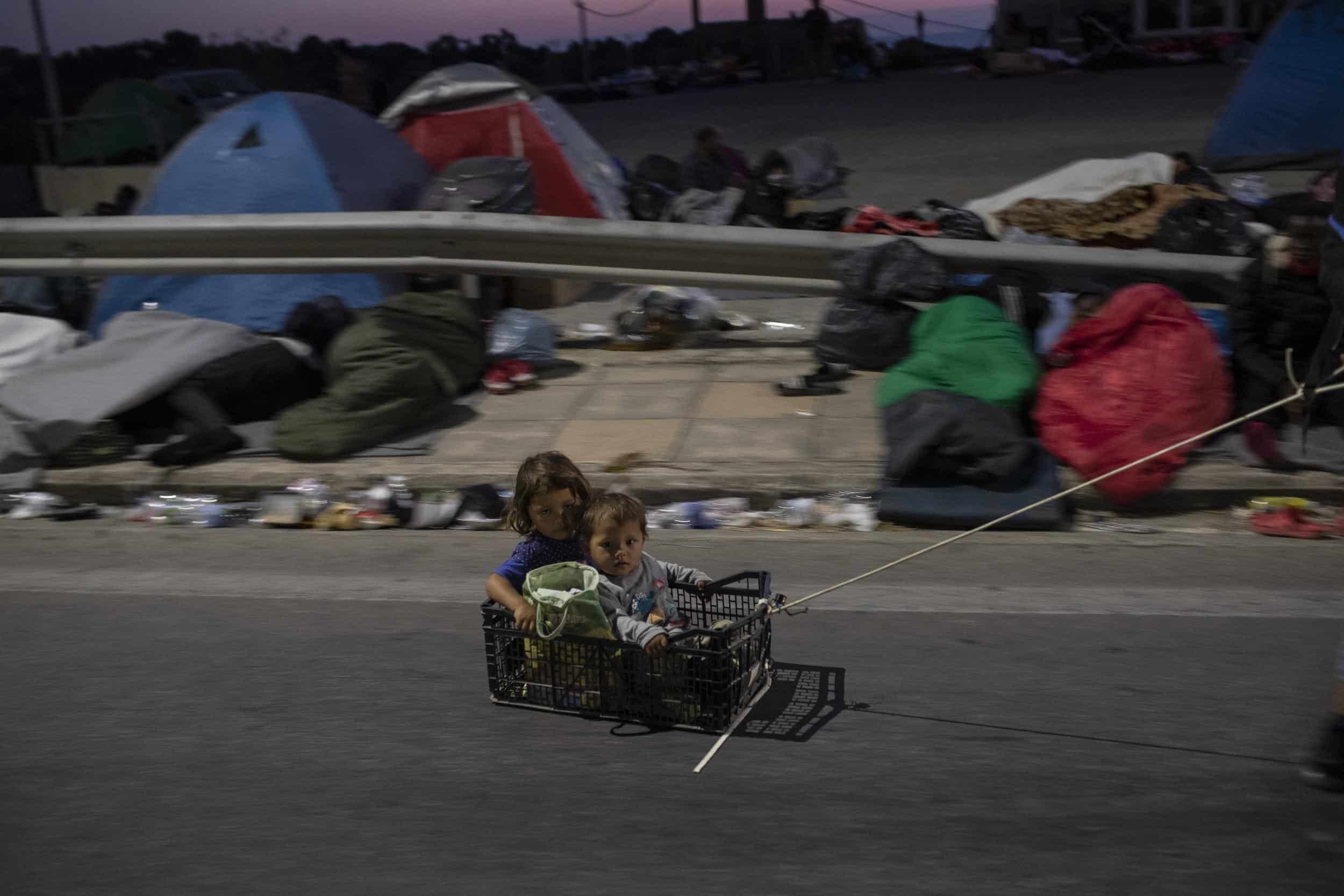 Thousands sleep in open after Greek refugee camp burns down