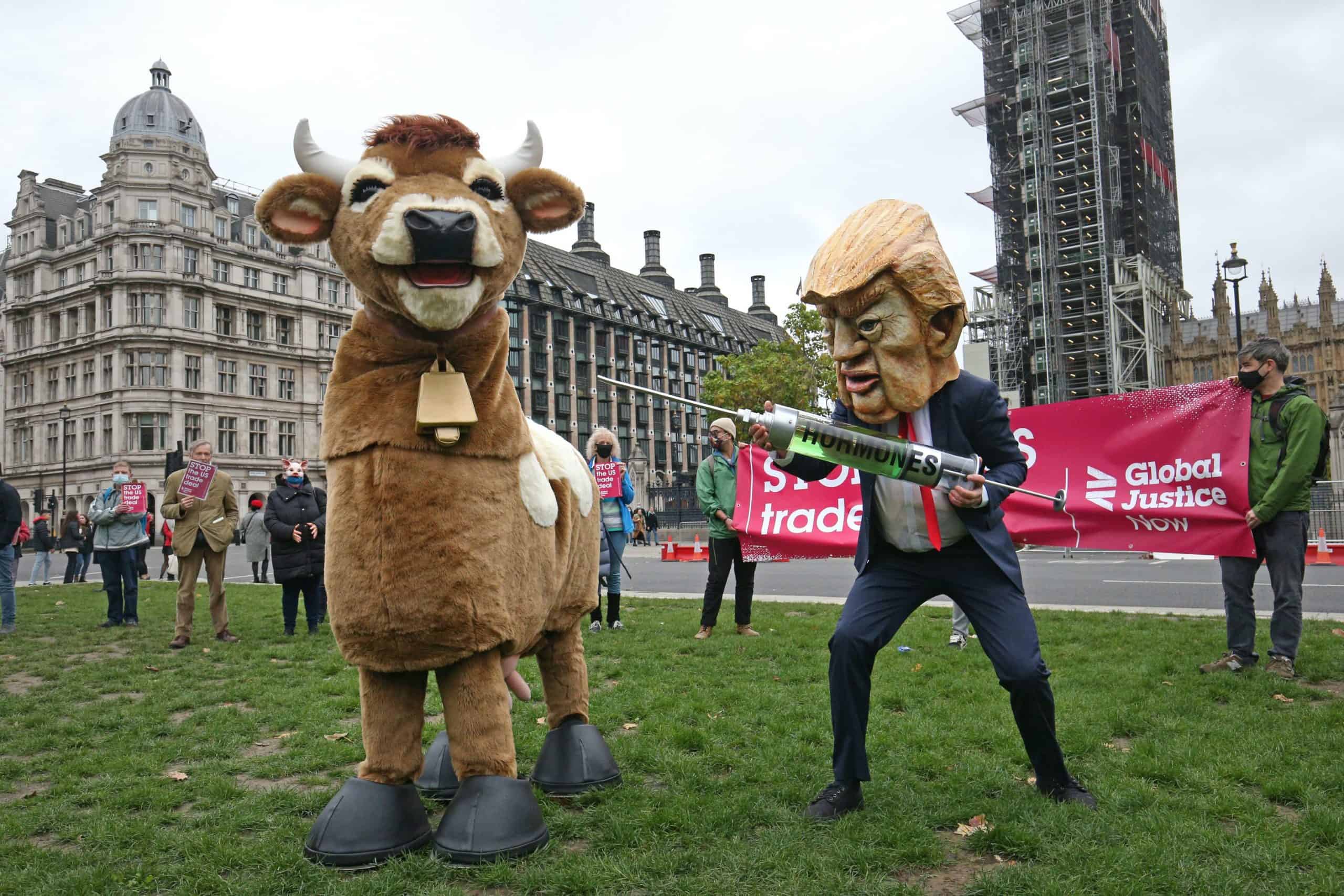 Pantomime cows and chlorinated chickens take to the streets to protest trade deal with US