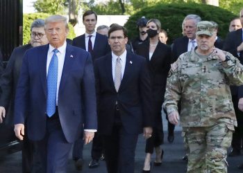 FILE - In this June 1, 2020 file photo, President Donald Trump departs the White House to visit outside St. John's Church, in Washington. Part of the church was set on fire during protests on Sunday night. Walking behind Trump from left are, Attorney General William Barr, Secretary of Defense Mark Esper and Gen. Mark Milley, chairman of the Joint Chiefs of Staff. Milley says his presence “created a perception of the military involved in domestic politics.” He called it “a mistake” that he has learned from. (AP Photo/Patrick Semansky)