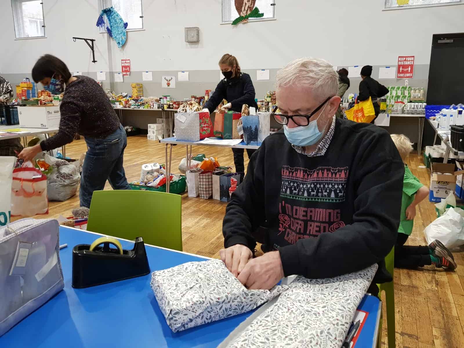 Jeremy Corbyn gift wraps presents for vulnerable children at local food bank