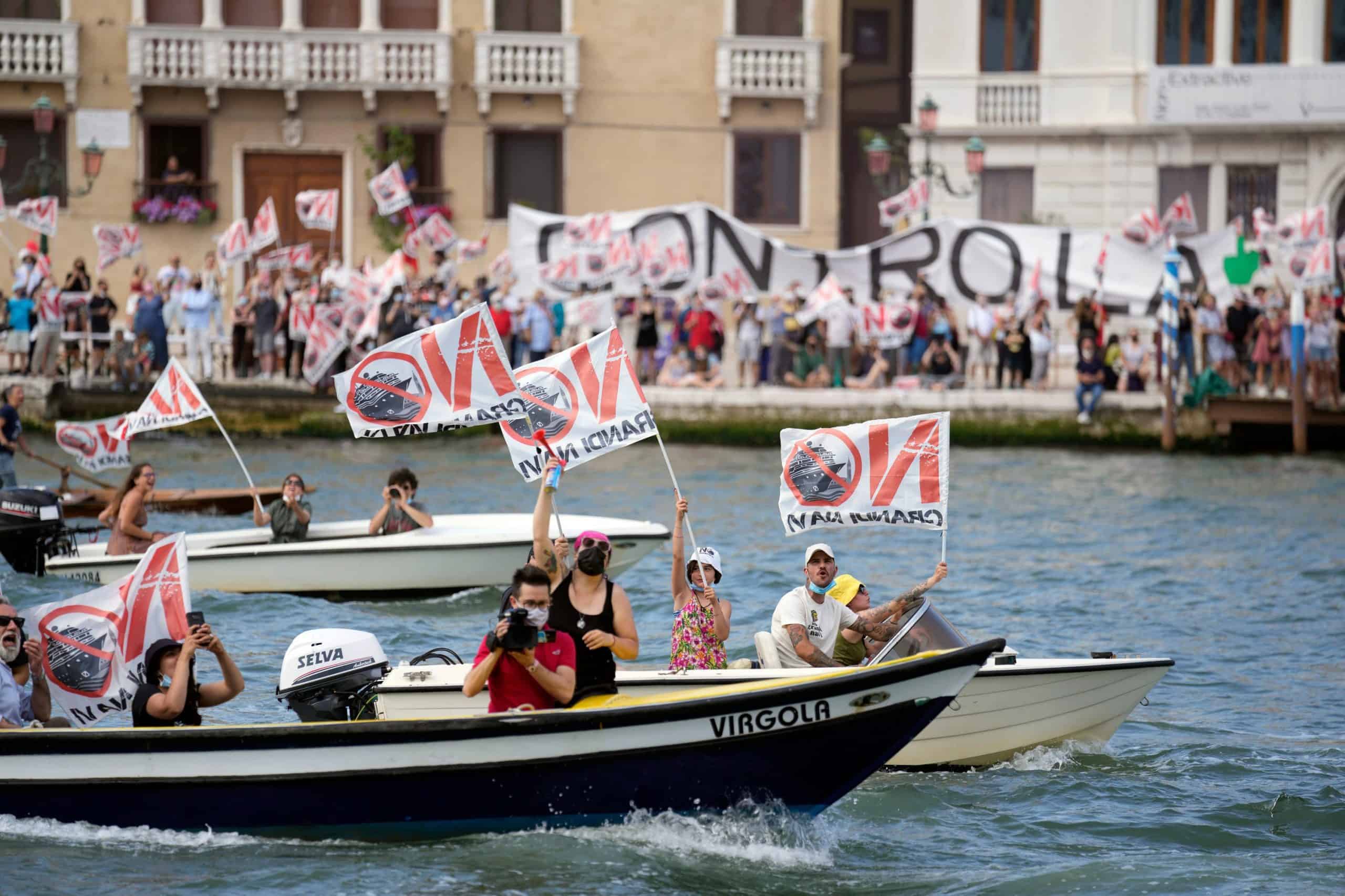 Protestors take to canals as controversial cruise ships return to Venice