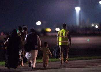 British nationals and Afghan evacuees depart a flight from Afghanistan at RAF Brize Norton. Picture date: Thursday August 26, 2021.