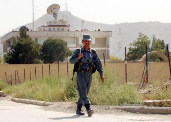 A guard walks in front of the British Embassy in Kabul, Afghanistan.