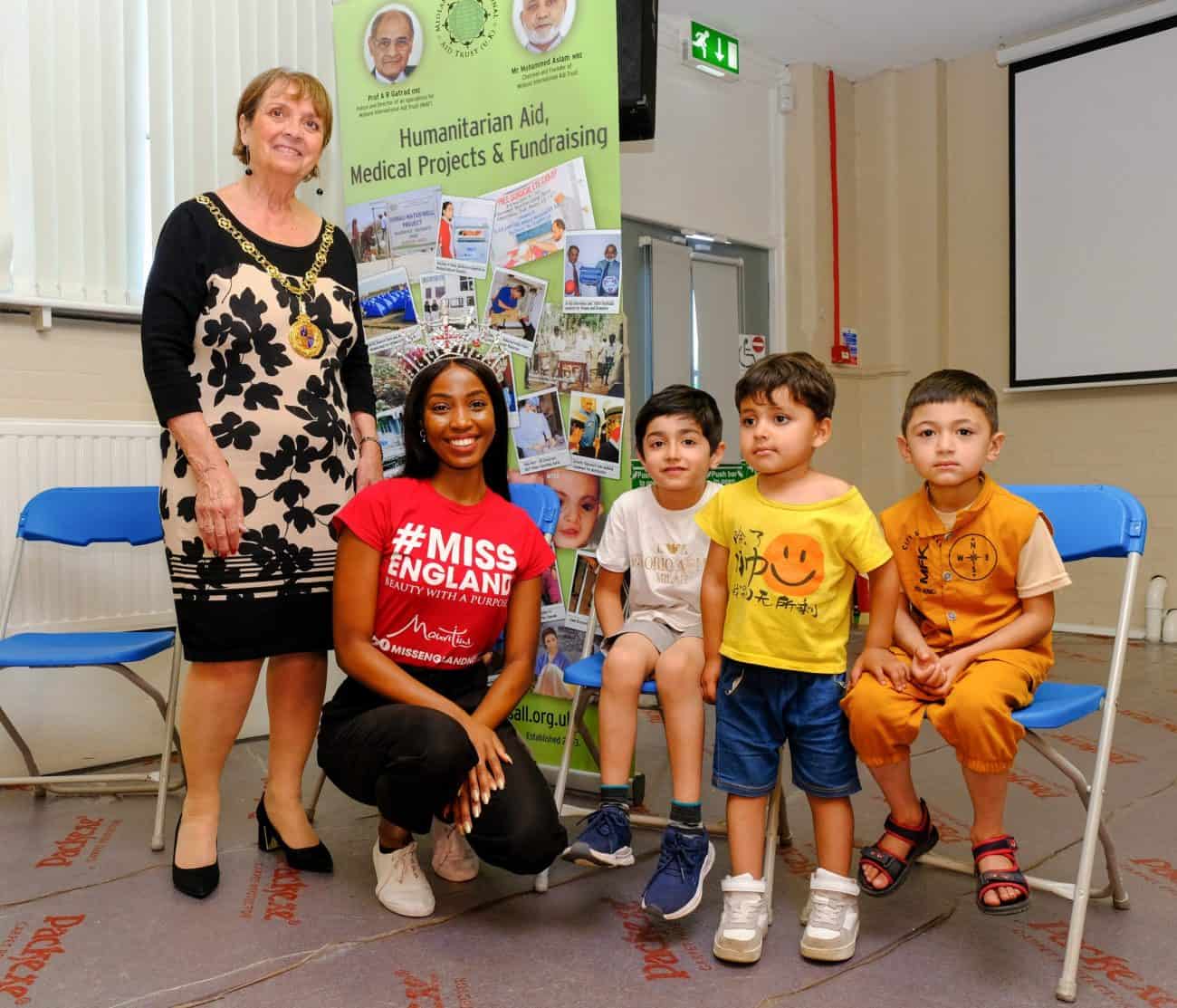 Miss England meets Afghan refugees to help distribute food as they arrive in UK