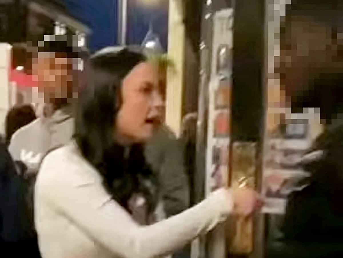 Woman who hurled racial abuse doorman is jailed