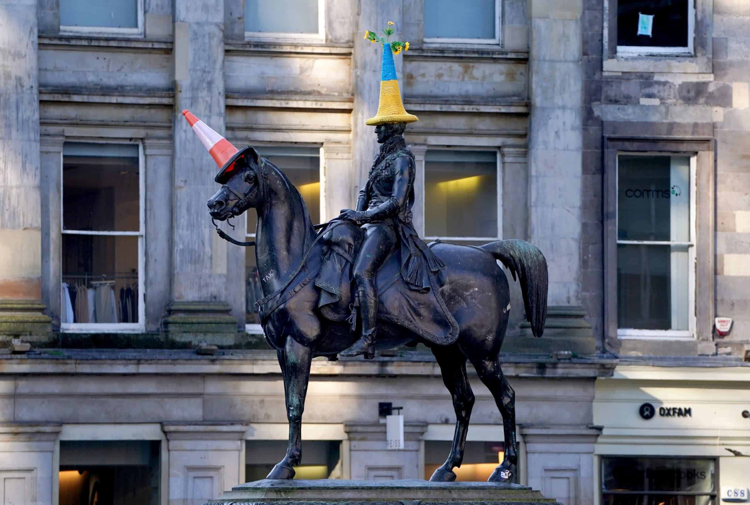 Watch: Cheers ring out as Glasgow’s famous traffic cone statue gets a makeover for Ukraine