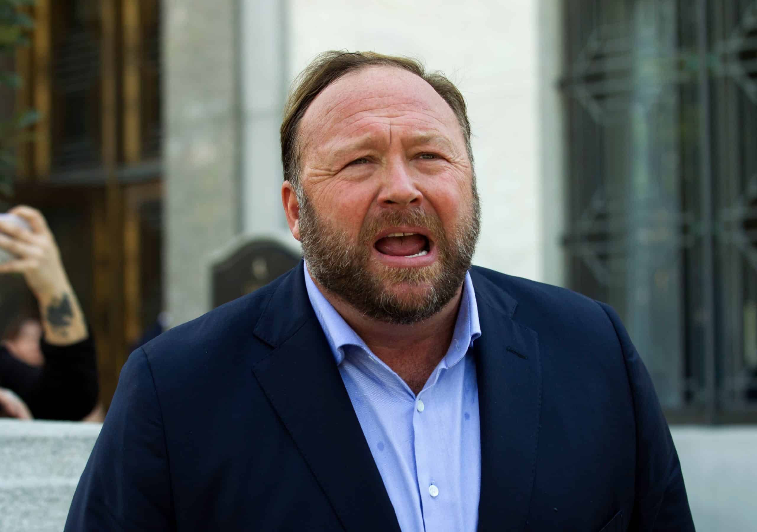 Conspiracy website Infowars files for bankruptcy as founder faces libel lawsuits