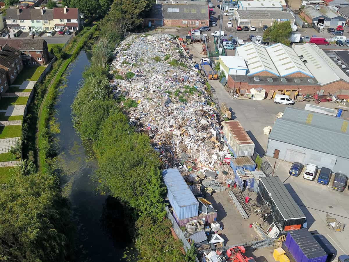 Watch: Residents fuming after mountain of dumped rubbish can be seen on Google Earth