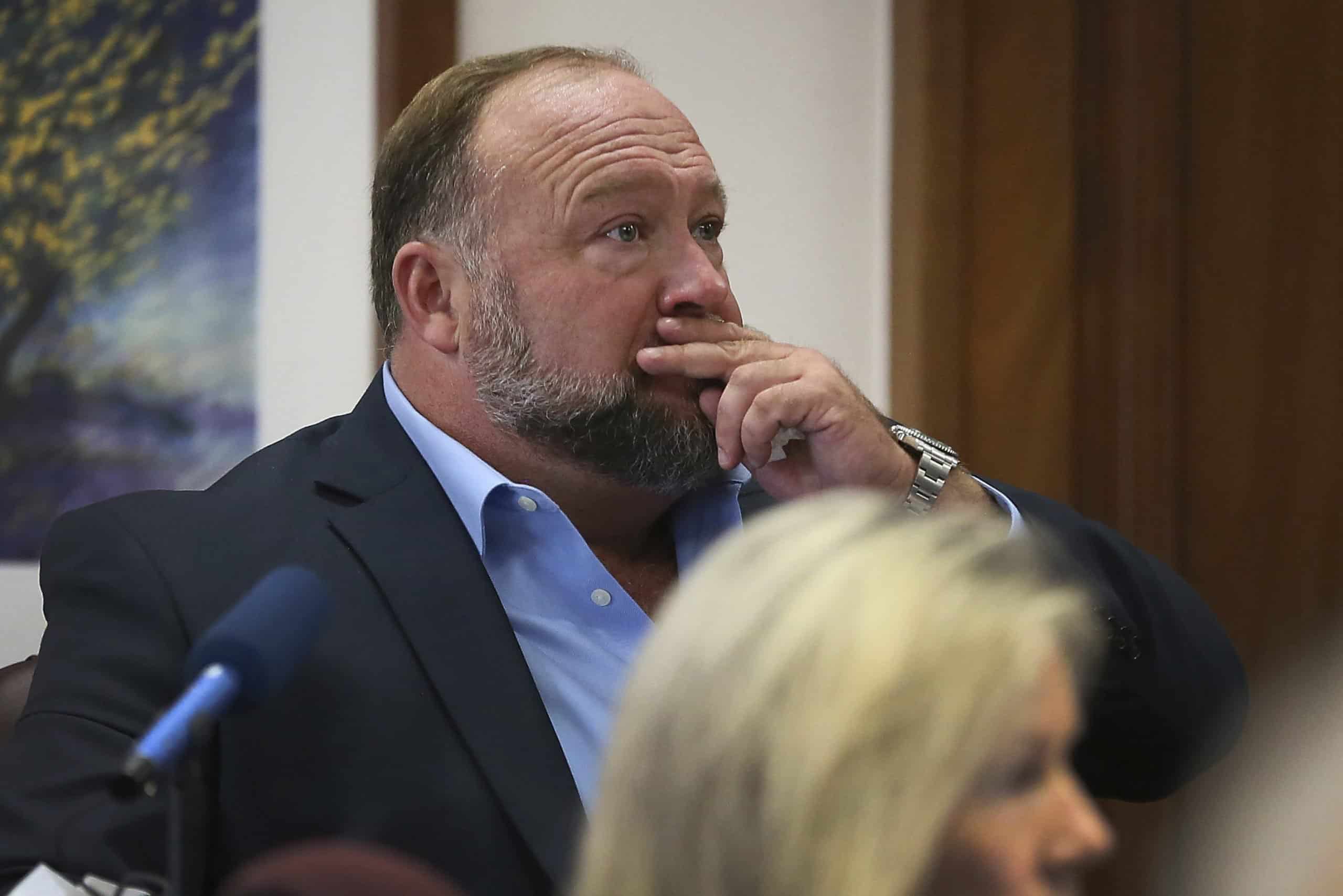 Alex Jones to pay compensation to Sandy Hook parents as clip of him learning lawyer accidentally leaked his phone content goes viral