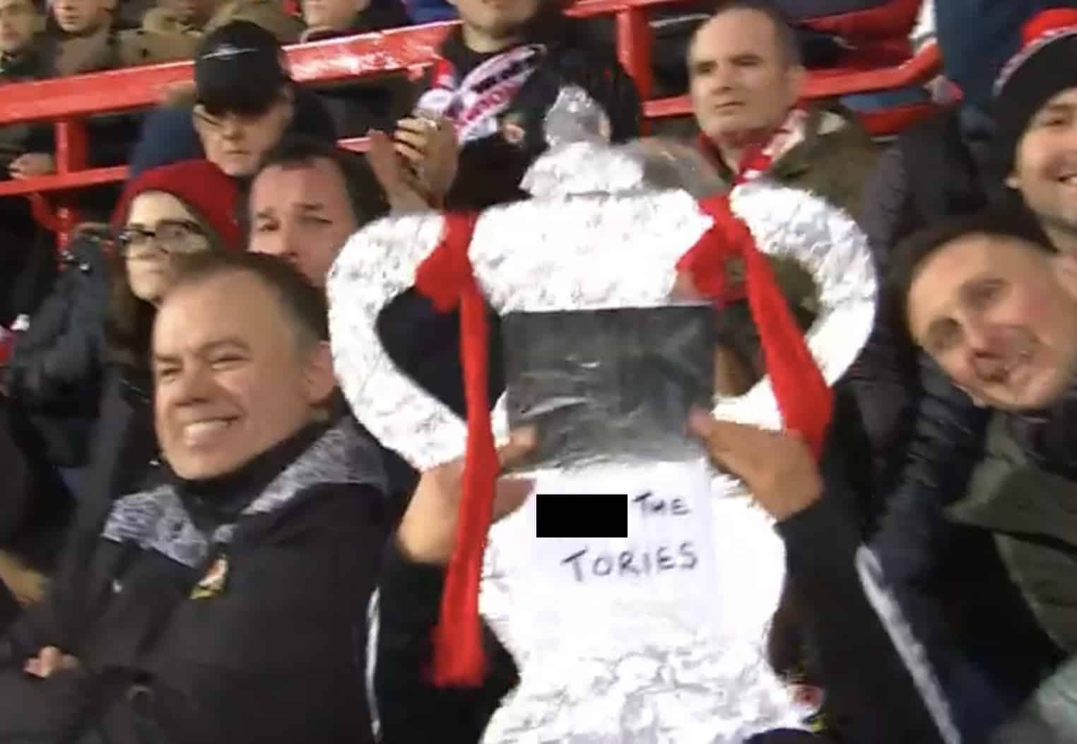 Cheeky! Wrexham fan sneaks ‘F*** the Tories’ sign onto BBC broadcast