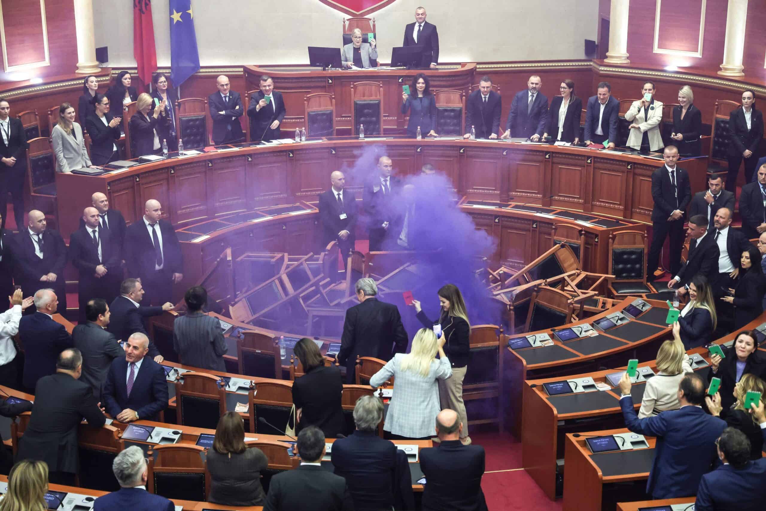 Chaos in Albanian parliament as opposition politicians throw firecrackers and chairs