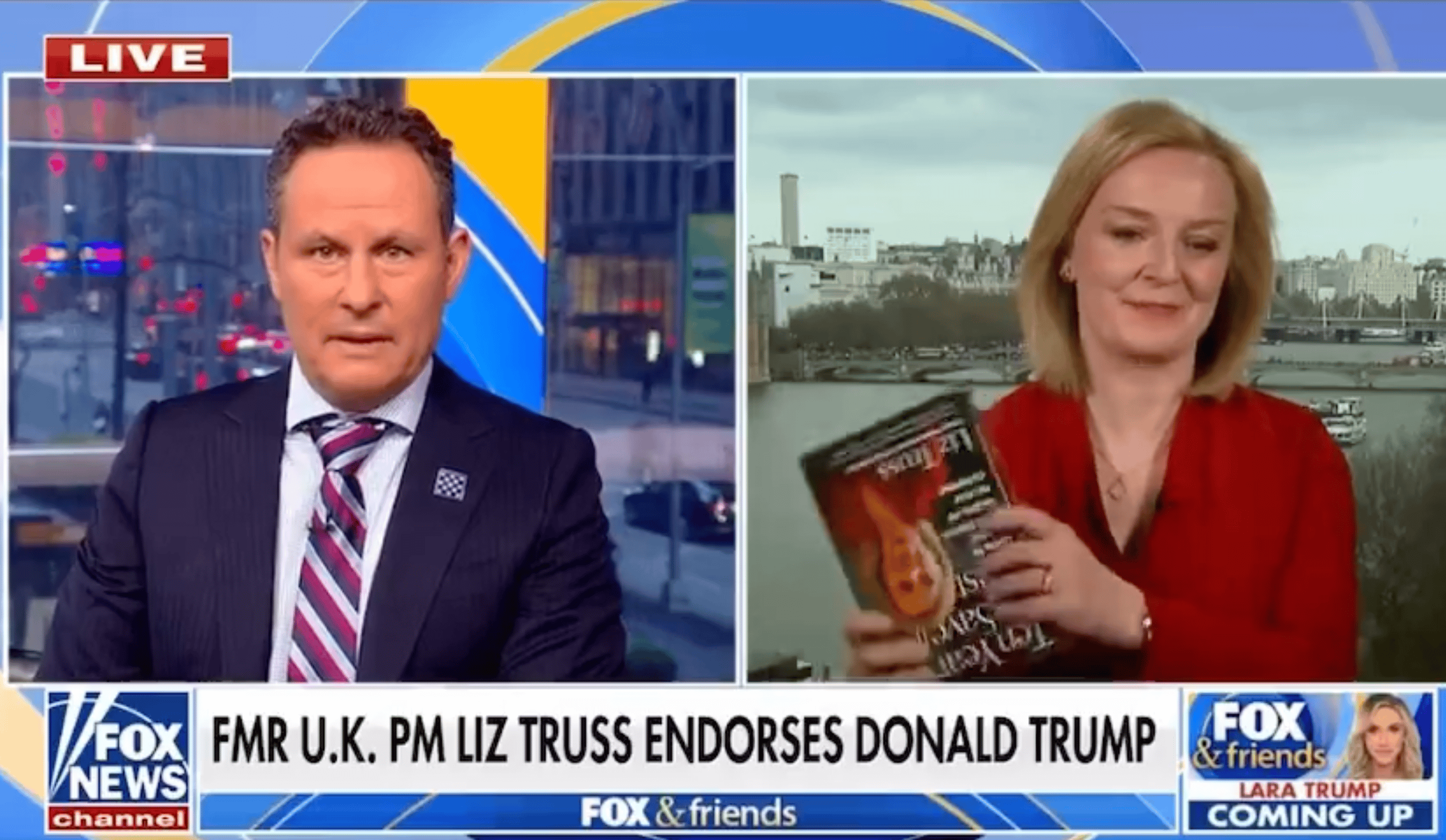 Liz Truss struggles to hold her book up the right way during Fox News howler