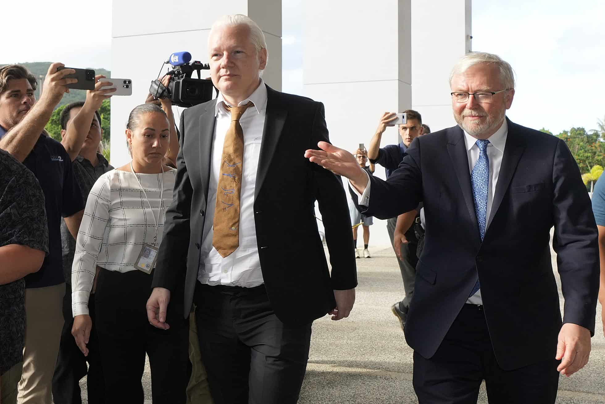 Julian Assange walks free from court and embarks to Australia