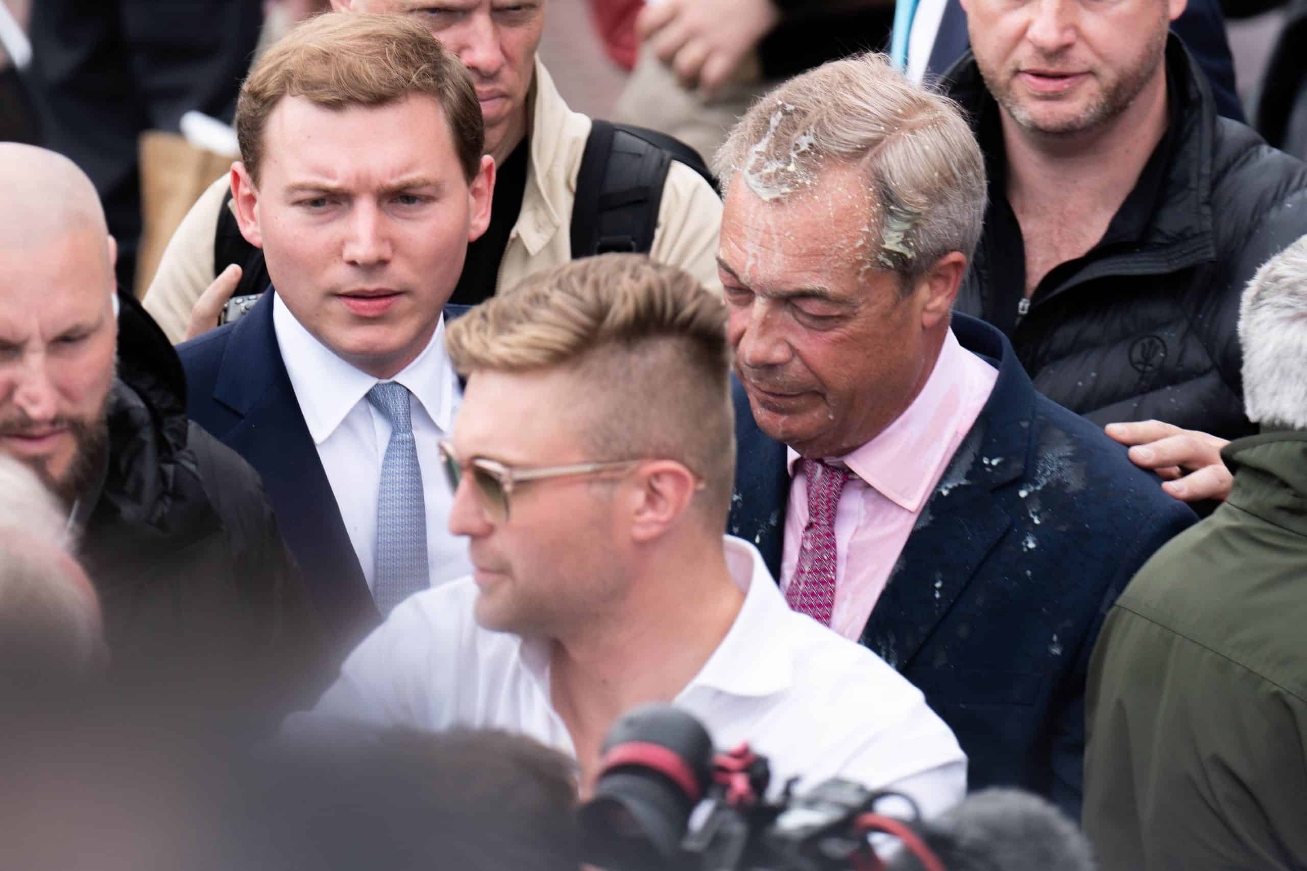 Woman charged with assault after milkshake thrown over Nigel Farage